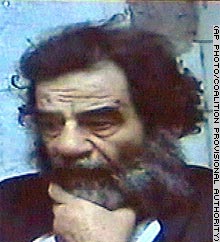 Saddam Hussein has long hair and a beard in video released by coalition authorities after his capture.